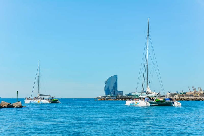 Barcelona: Catamaran Party Cruise with BBQ Meal - The swimming stop and the giant donut