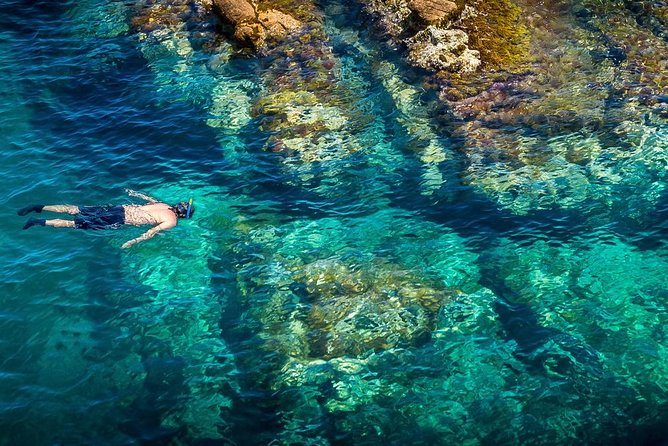 Barcelona Costa Brava Kayak, Snorkel & Cliff Jump Day Tour - Paddling beneath the Camino de Ronda