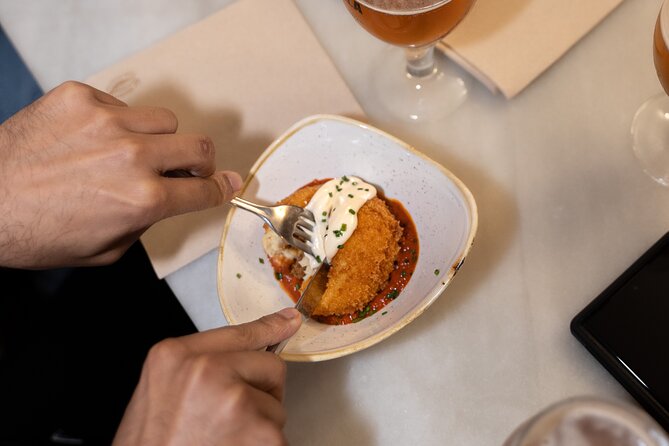 Barcelona Old Town Tapas Tour: Vermouth, Bites & Hidden Gems - City Hall, a local sweet, and a Picasso detail