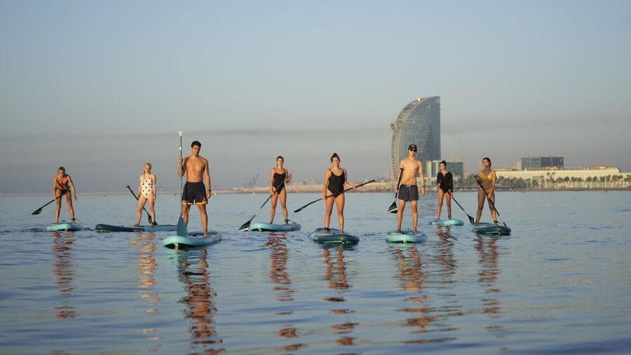 Barcelona: Sunrise Paddleboarding with Instructor and Photos - The short walk to Barceloneta Beach