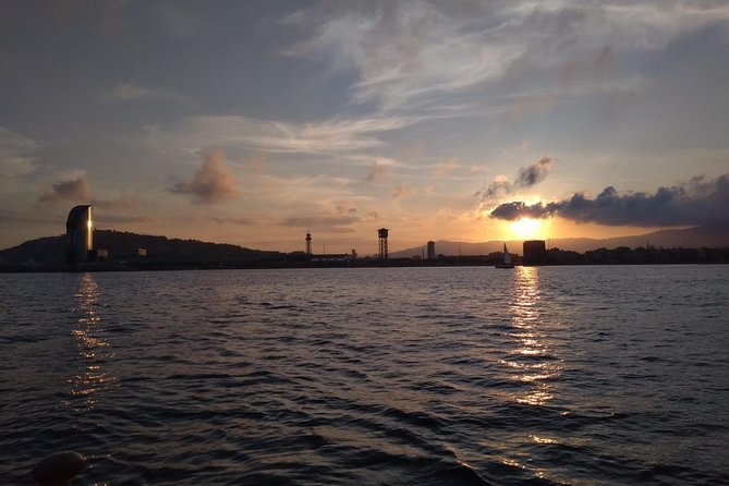 Barcelona Sunset Cruise with Light Snacks and Open Bar - Leaving Port Vell as Barcelona lights up