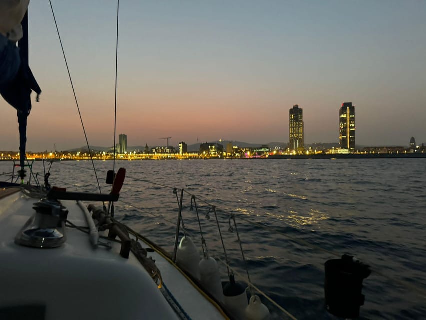 Barcelona: Sunset Sailboat Cruise with Drinks and Snacks - Barcelona’s skyline from the bay
