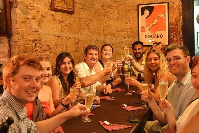 Barcelona Tapas Walking Tour: Food, Wine & History - Walking through Barri Gotic with a plate in hand