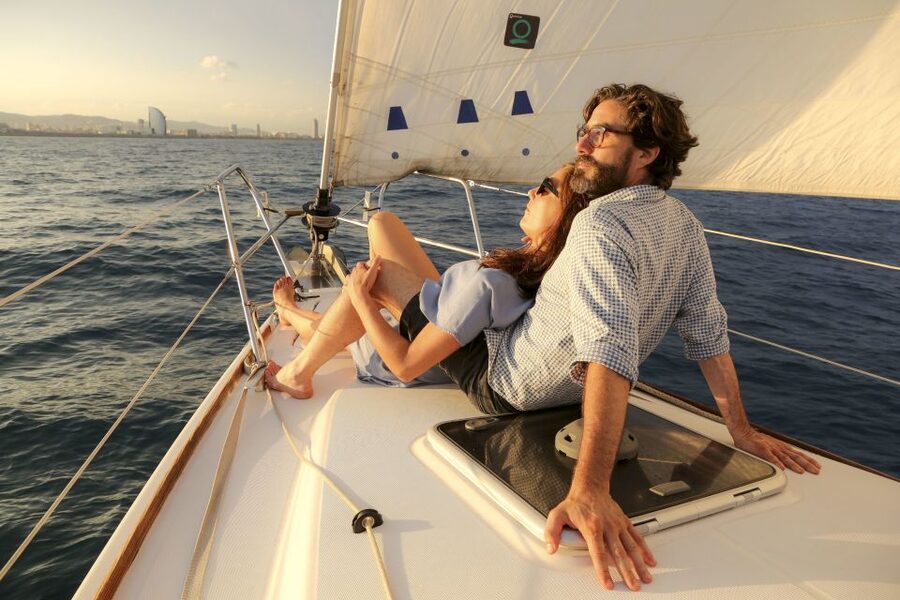 Barcelona: Unique Sunset Sailing Tour with Tapas & Open Bar - Leaving Port Olimpic Behind