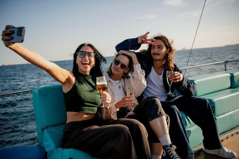 Barcelona: Wooden Boat Sailing with Tapa and Welcome Drink - Music and the social mood onboard