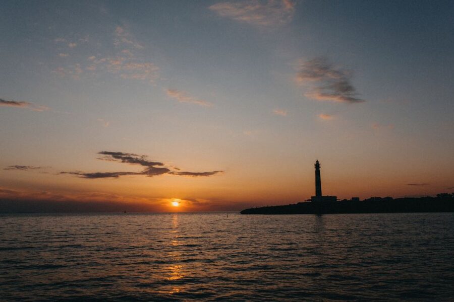 Cala'n Bosch: 2-Hour Sunset Sightseeing Tour - Artrutx Lighthouse gives the cruise its first coastal marker