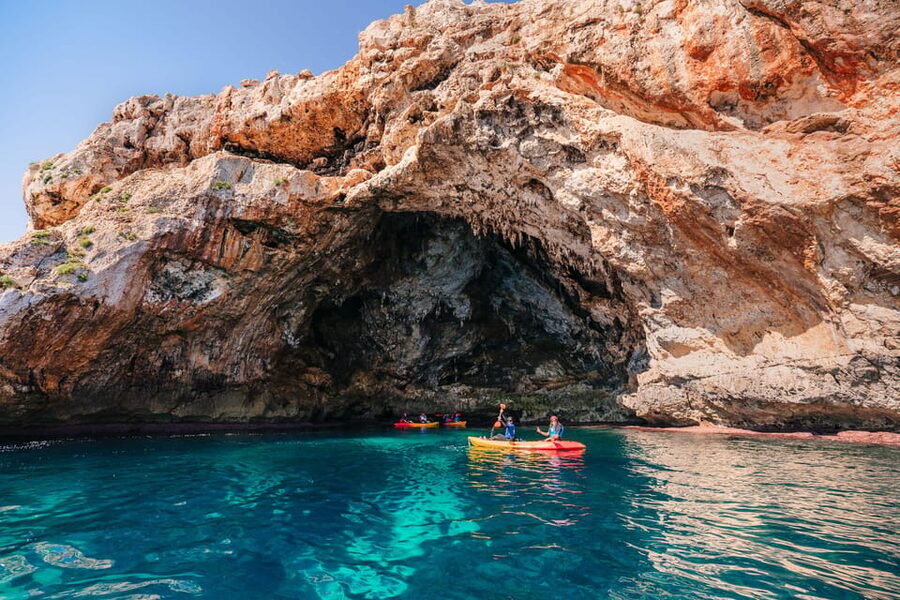 Cala Varques: Guided Sea Caves Kayak & Snorkeling Expedition - Paddling along the cliffs toward Cala Falcó