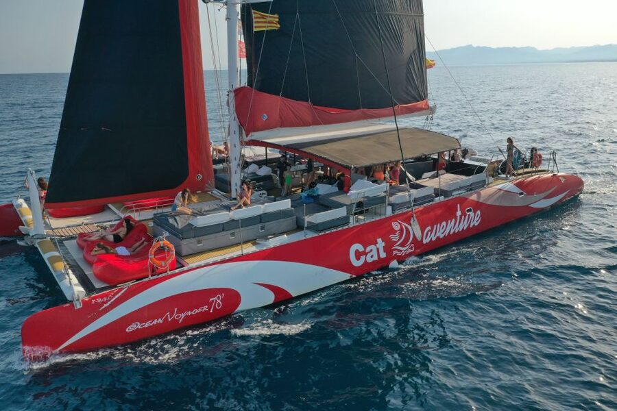 Cambrils: Catamaran Cruise with Drinks and BBQ Lunch Option - Your Balinese bed and the wide catamaran deck