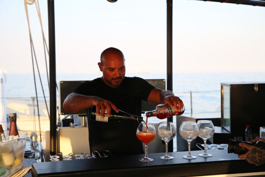 Cambrils: Sunset Catamaran Cruise with Drinks - Drinks, music, and the onboard mood