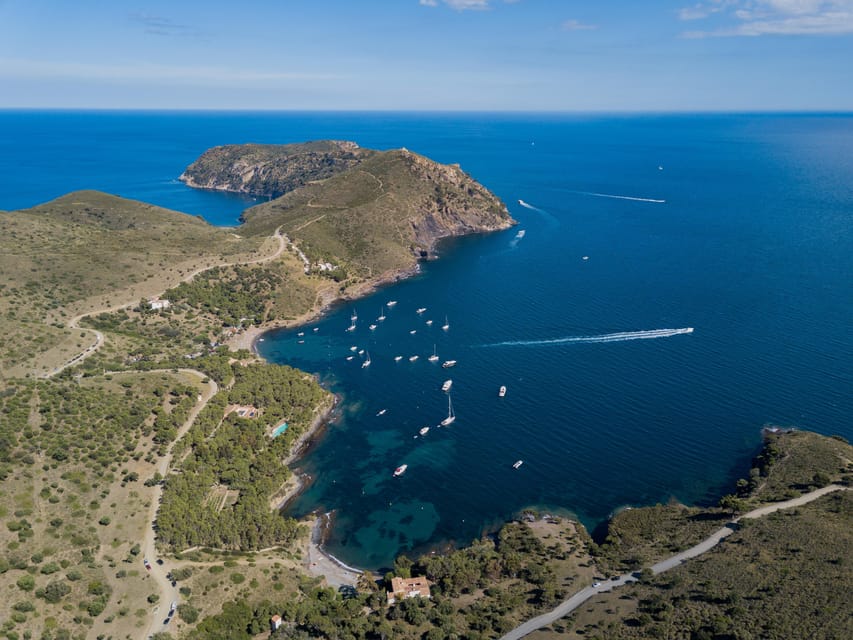 Cap Norfeu: Costa Brava Catamaran Trip with Underwater Views - The audio guide and onboard bar