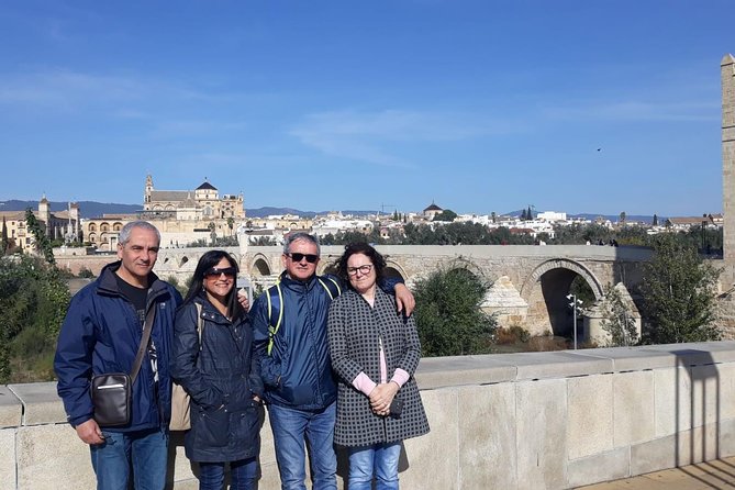 Cordoba & Carmona with Mezquita, Synagoge & Patios from Seville - Crossing the Roman Bridge into Córdoba
