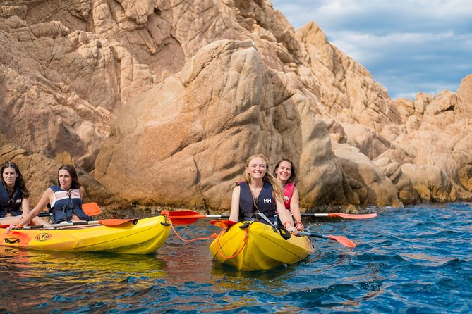 Costa Brava Kayak & Snorkel Tour + Picnic from Barcelona - Kayaking along the rocky coast