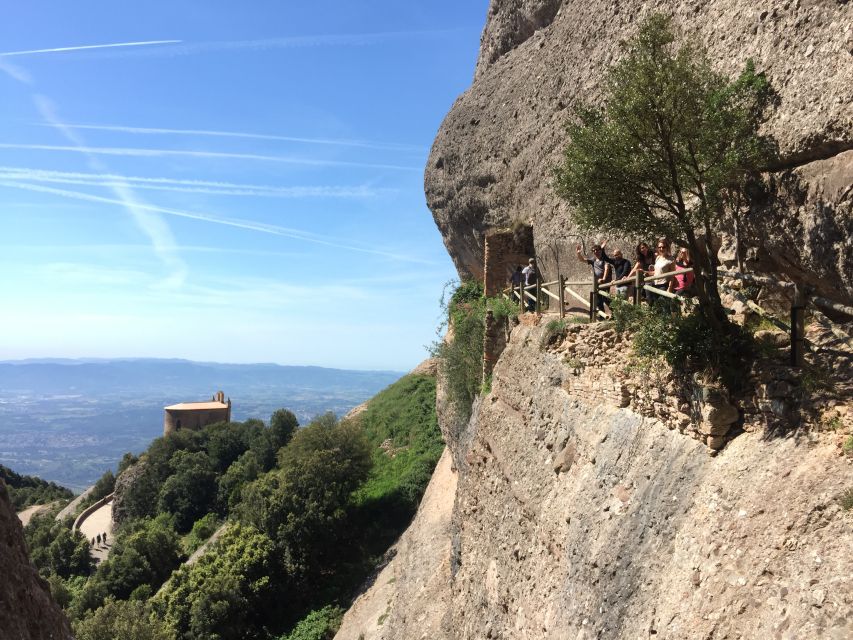 From Barcelona: Montserrat Monastery & Scenic Mountain Hike - Taking the funicular toward the mountain views