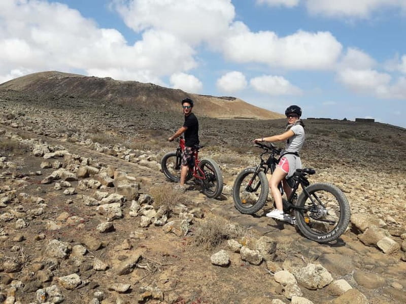 From Corralejo: Fuerteventura Guided E-Bike/E-scooter Tour - Riding through rough volcanic ground