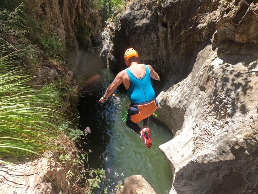 From Estepona: Guadalmina River Guided Canyoning Adventure - Swimming through the narrow canyon walls