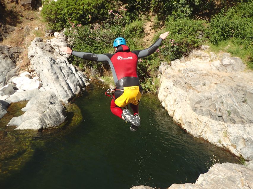 From Marbella: Guadalmina River Guided Canyoning Adventure - Swimming through clear pools and natural slides