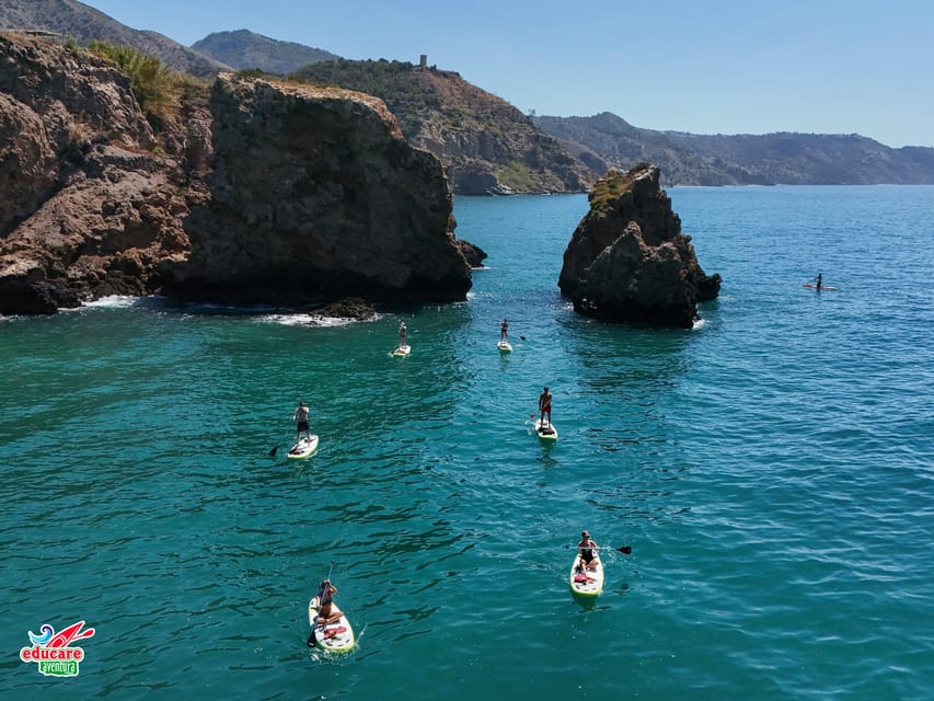 From Nerja: Guided Paddle Surf Cliffs and Maro Waterfall - Swimming, coral, and fish below the boards