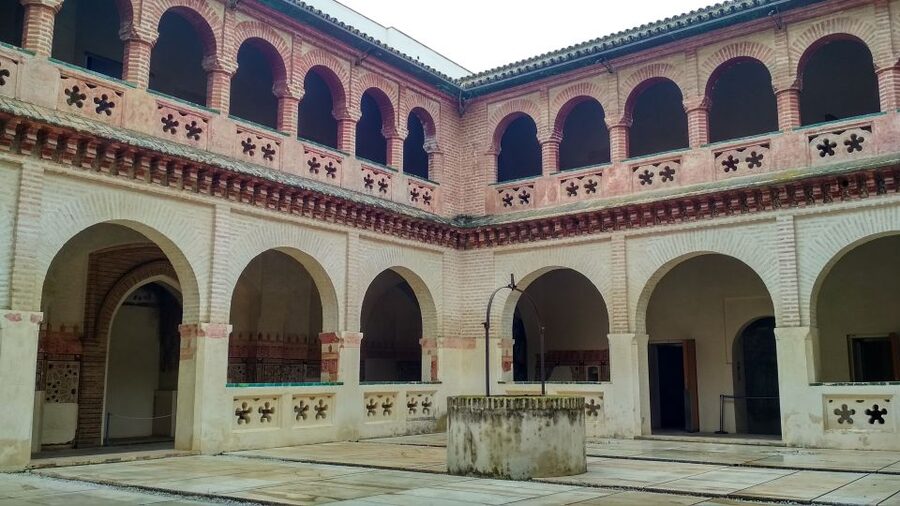 From Seville: Italica Roman City & Medieval Monastery Tour - Walking through Italica’s Roman streets