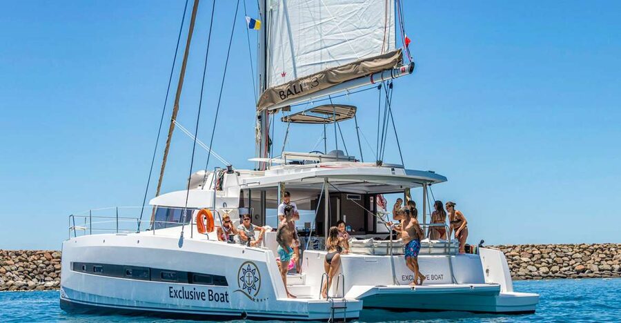 Gran Canaria: Catamaran Day Trip with Food and Drinks - The first stop: swimming, fish, and shared water equipment