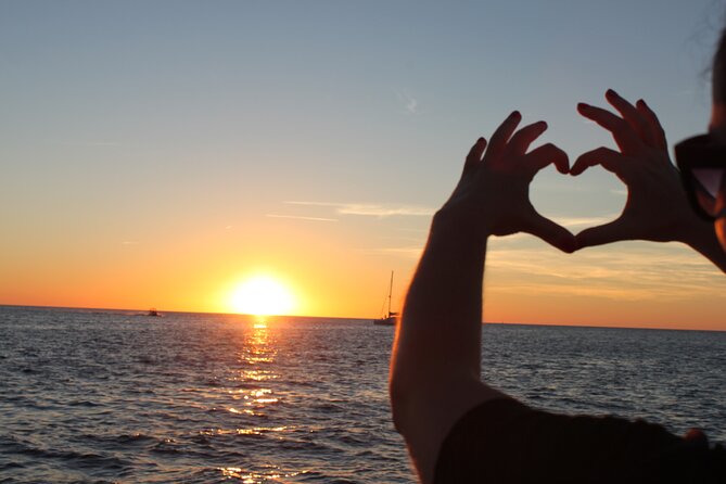 Ibiza Sunset Snorkeling Beach and Cave Tour - San Antonio Bay sets the scene
