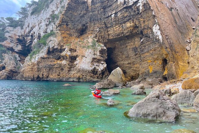 Kayak Paradise: Cala Portixol Snorkel, Cave & Cliff Jumping Tour - Isla de Portixol and the blue lagoon