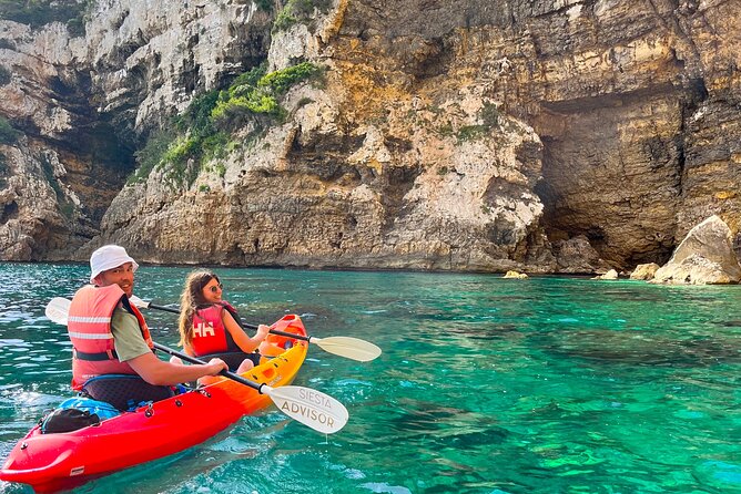 Kayak Paradise: Cala Portixol Snorkel, Cave & Cliff Jumping Tour - Paddling toward Cala el Pom