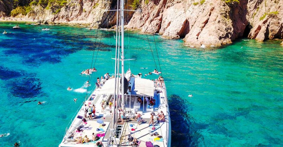 Lloret de Mar: Catamaran Sailing Cruise with BBQ and Drinks - Meeting the catamaran on Lloret beach