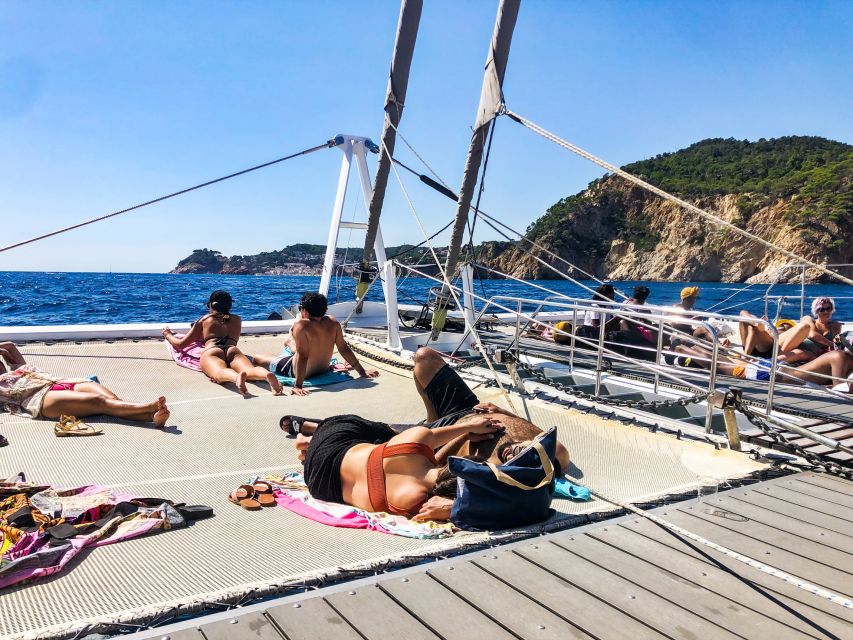 Lloret de Mar: Catamaran Sailing Cruise with BBQ and Drinks - Anchoring for swimming, snorkeling, and floating