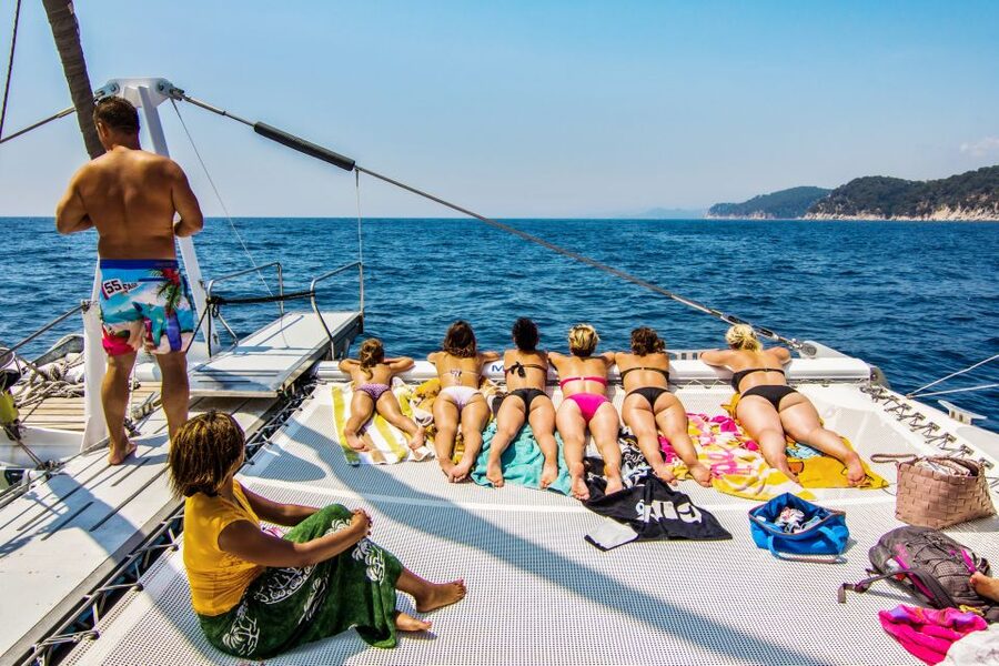 Lloret de Mar: Catamaran Sailing Cruise with BBQ and Drinks - The return trip turns up the music