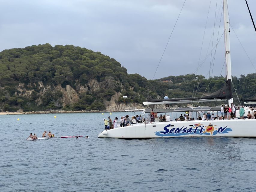 Lloret de Mar: Sunset Catamaran Cruise with DJ and Drinks - The quiet inlet and swim stop