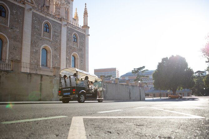 Madrid Express Tour with Local Guide in Eco Tuk Tuk Private - The Spanish Congress and its neoclassical lions
