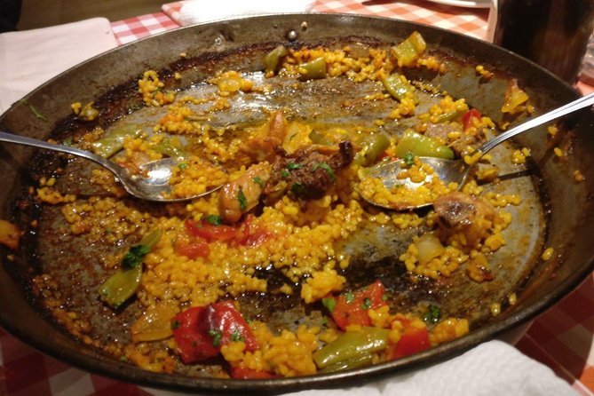 Madrid Local's Tapas Tour Dinner with a side of History - The main event: paella and a family-style dinner