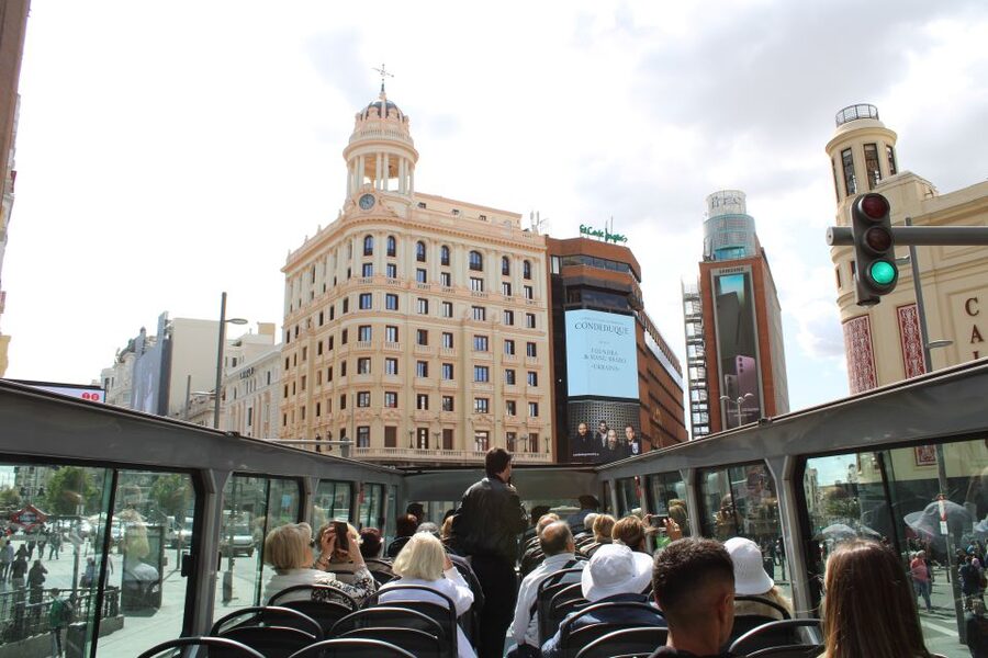 Madrid: Open-Top Big Bus Sightseeing Tour with Live Guide - Biblioteca Nacional, Atocha Station, and Parque de Atenas