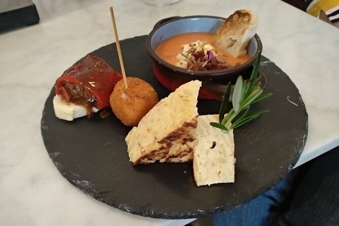 Madrid Small Group Tapas Tour at 4 Venues -Lunch or Dinner - Iberian ham, cold cuts, and a lesson in quality