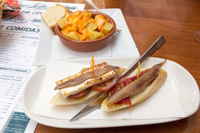 Malaga Food Tour: Tapas, Drinks and Delights with a Local - Plaza de la Merced brings in classic Andalusian flavors