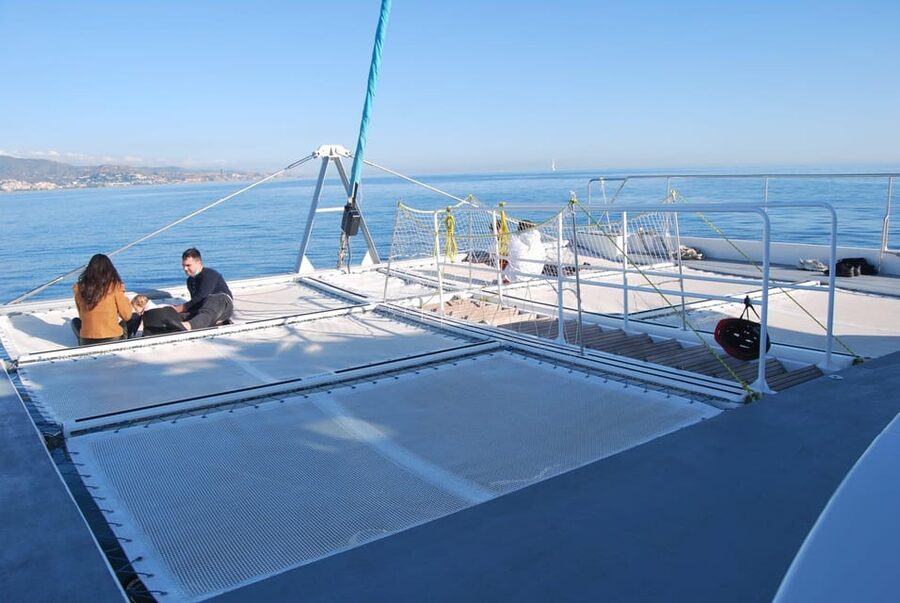 Malaga: Sailing Catamaran Sunset Cruise with Live DJ & Drink - What the Crew Adds