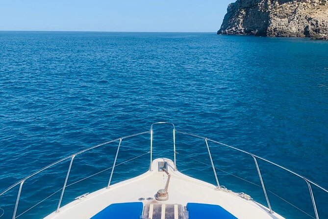 Mallorca Beach & Caves 4hr Boat Trip Drinks, Tapas, SUP & Snorkel - Leaving Port d’Alcúdia for the cliffs