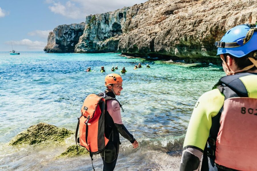 Mallorca: Cova des Coloms Caving Trip with Hotel Transfer - Inside the cave: climbing, pools, and limestone shapes