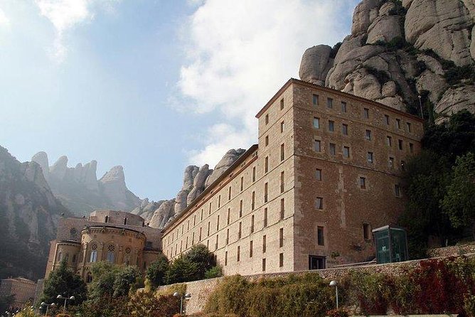 Montserrat Day Trip Private or Small Group with Basilica Tickets - Catalan Cheese, Ham, and Market Tasting