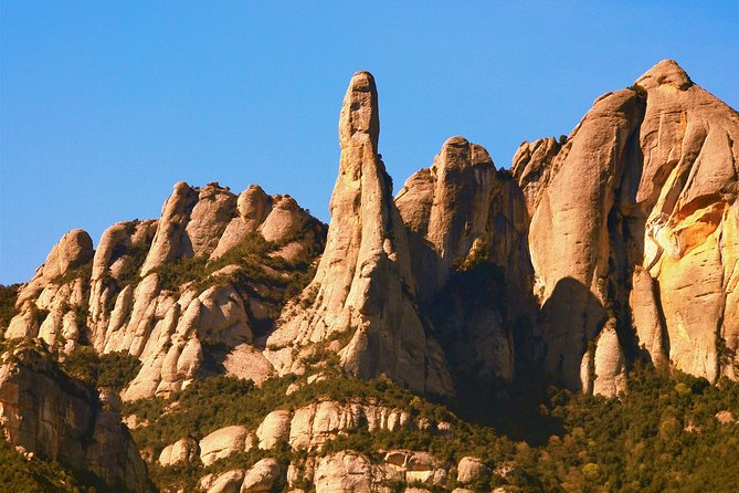 Montserrat Half Day with Cable Car and Easy Hike from Barcelona - Walking from the upper mountain to the monastery
