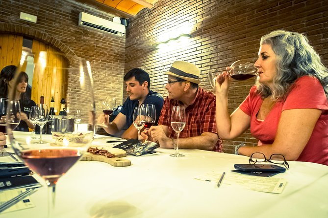 Montserrat & Winery Visit Tour with Traditional Farmhouse Lunch - A small winery and four Catalan pours