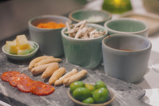 Paella Cooking Class in Madrid with Bottomless Wine Pairing - Building Paella Step by Step