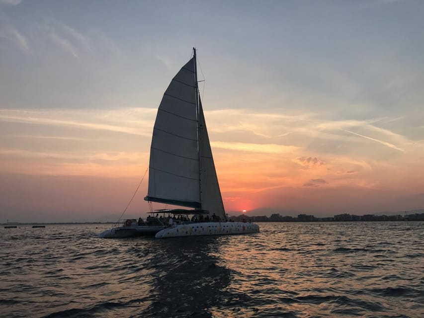 Palma de Mallorca: Sunset Sailing Catamaran Trip with Drink - Sunset views, music, and the onboard mood