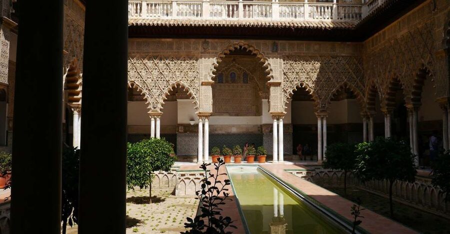 Royal Alcázar of Seville Skip-the-Line Guided Tour - Finding the orange umbrella in Plaza del Triunfo