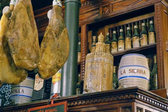 Sevilla Food Tour: Tapas, Wine, History & Traditions - Plaza del Pan and the flamenco dress tradition