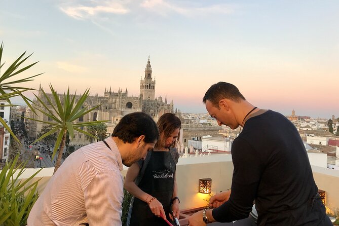 Sevilla: Rooftop Paella Cooking Class & 30-minute expert Q&A - Sunset, music, and the social side