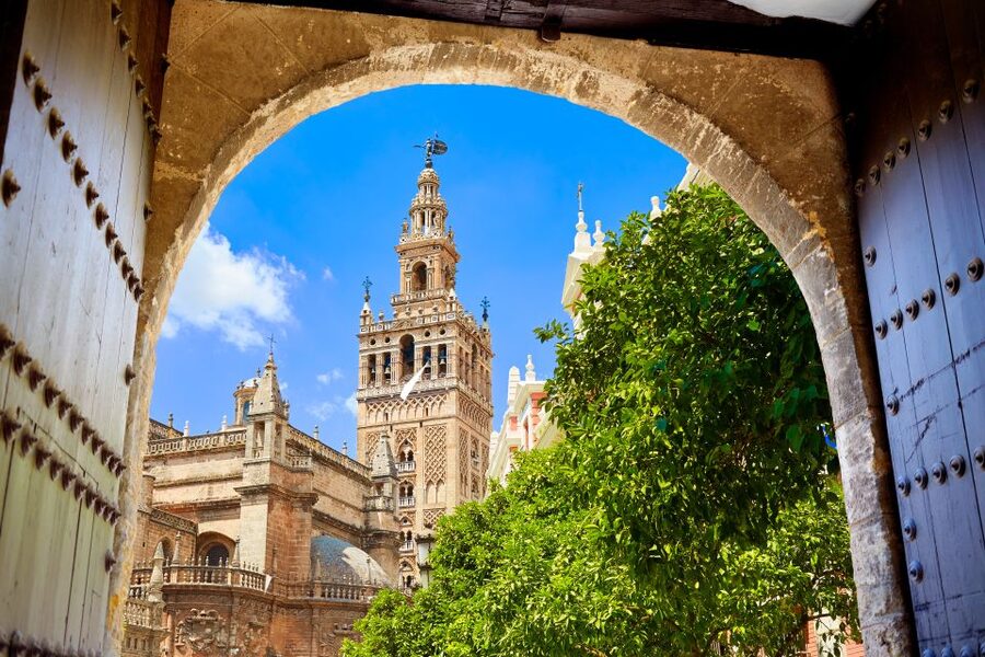Seville: Cathedral, Giralda, and Alcazar Guided Tour - Climbing the Giralda’s 104-meter tower