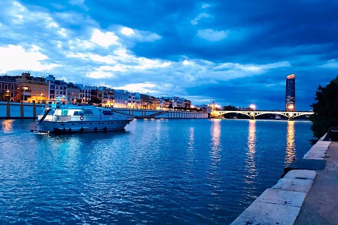 Seville: Cruise along the Guadalquivir River with appetizer - The opening stretch: drink, ham, and river views