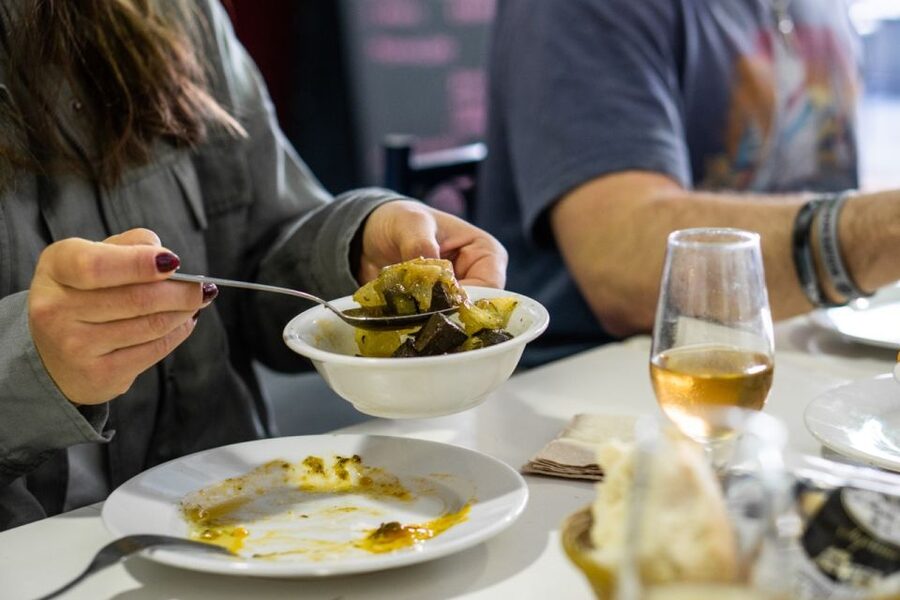 Seville: Flavors of Andalucía Guided Food Tour with Tastings - Crossing into Triana for the first taste
