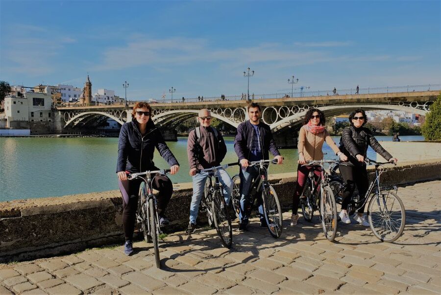 Seville: Highlights Bike Tour with Local Guide - Along the river to Seville Tower and Triana